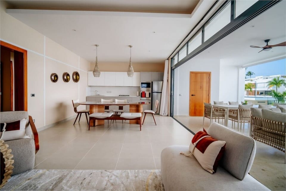 Enjoy an open-concept layout with comfortable seating, a dining area, and a fully equipped kitchen.