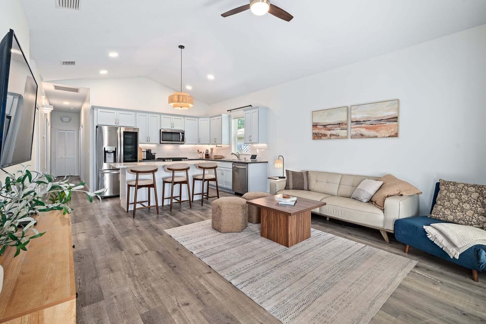 The living room flows openly into the kitchen, creating an easy, connected layout for gathering.