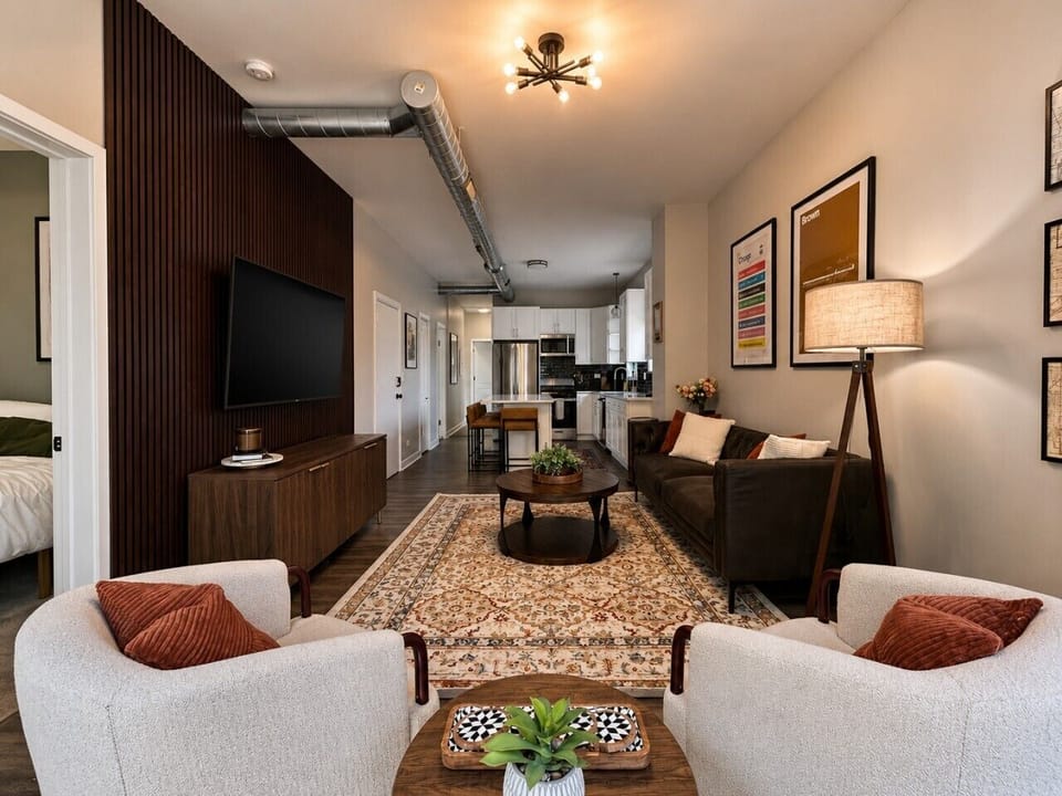 Moody, curated living room with Chicago-inspired design, layered textures, and space to gather and unwind.