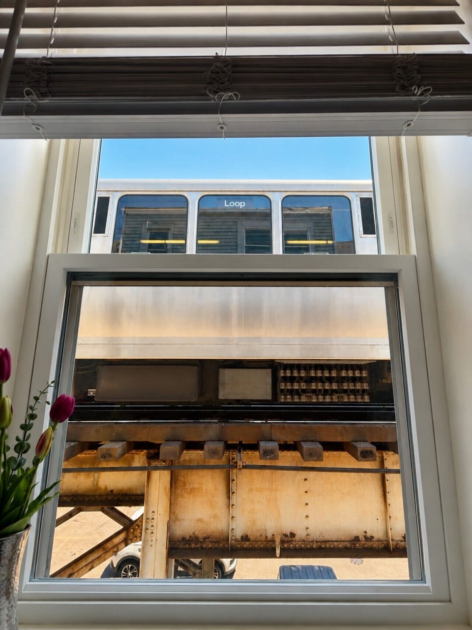 A true Chicago moment—views of the “L” right outside the kitchen window, central to the Brown Line Lounge experience.