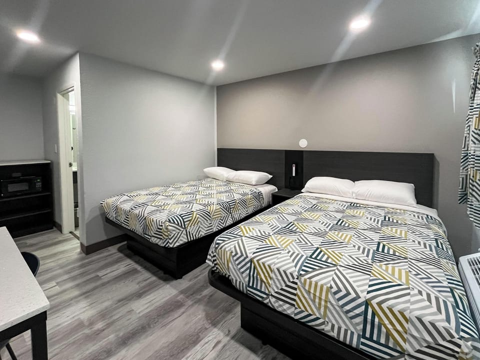 Deluxe Room, 2 Double Beds, Non Smoking, Refrigerator (Mircowave) | WiFi (free), bed sheets