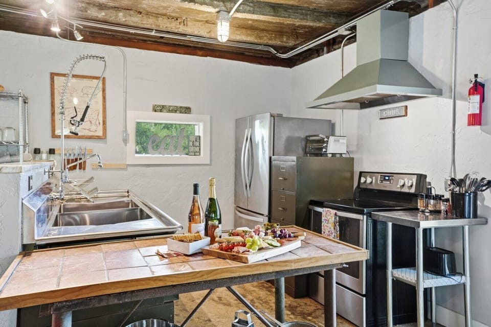 Kitchen | Stainless Steel Appliances & Prep Island | Deep Farmhouse Sink