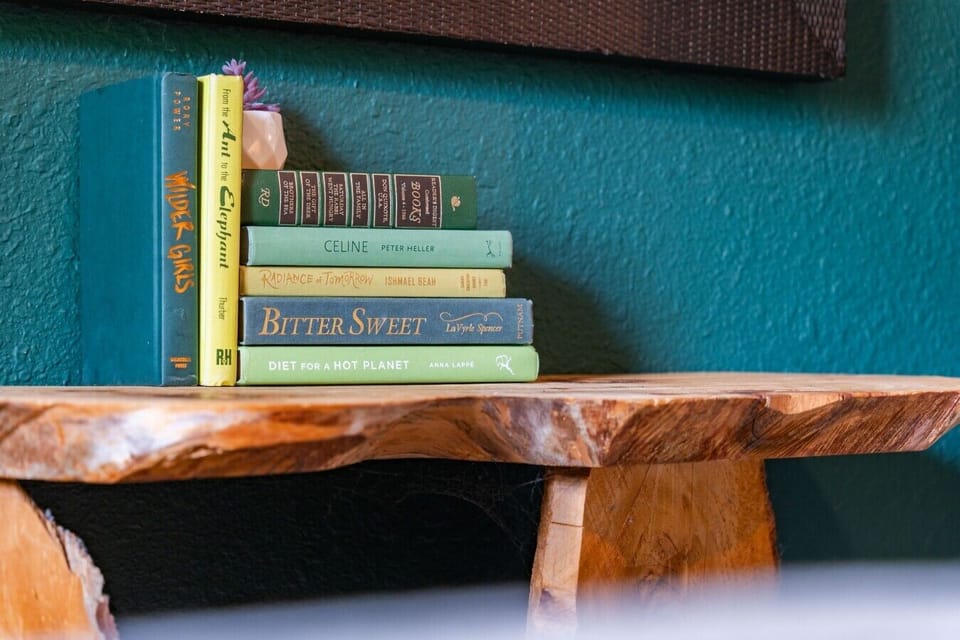 Bedroom 2 | Rustic Wood Bench & Book Collection