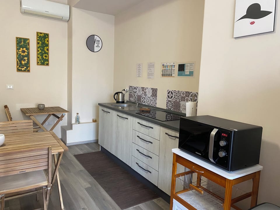 Espresso maker, full-size fridge, microwave, stovetop