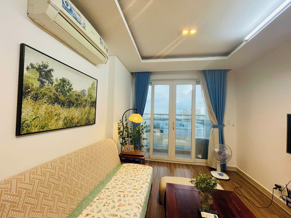 Classic Apartment, Balcony, City View | Living area | 55-inch TV with satellite channels