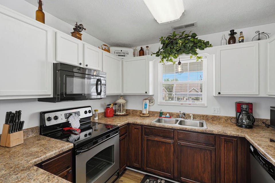 Whip up your favorite meals in this fully-equipped kitchen with modern appliances, ample counter space, and everything you need to feel at home during your stay.