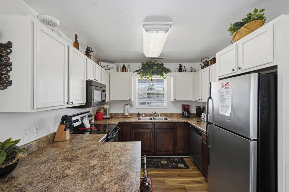 Step into your fully-equipped kitchen with granite counters, modern appliances, and everything you need to prepare meals like you're at home.