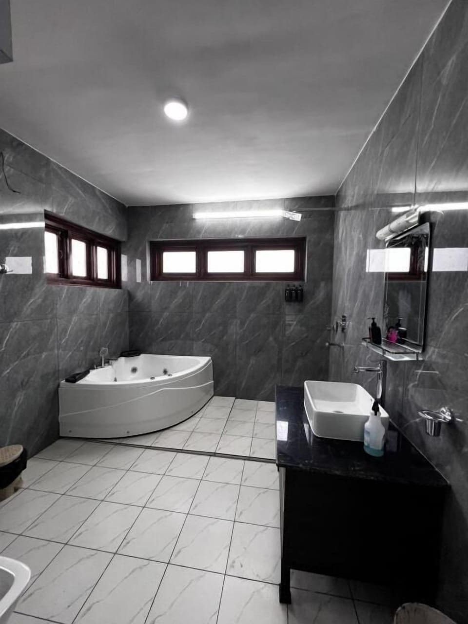 Shower, hair dryer, slippers, towels