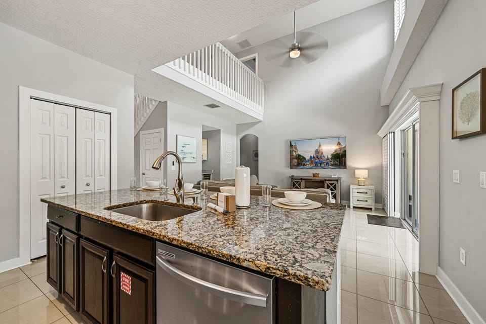 Open-concept kitchen overlooking the spacious living room, making it easy to cook, dine, and gather together.