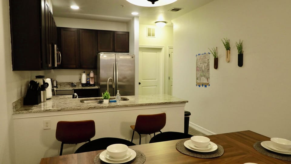 Modern kitchen and dining space with breakfast bar and seating