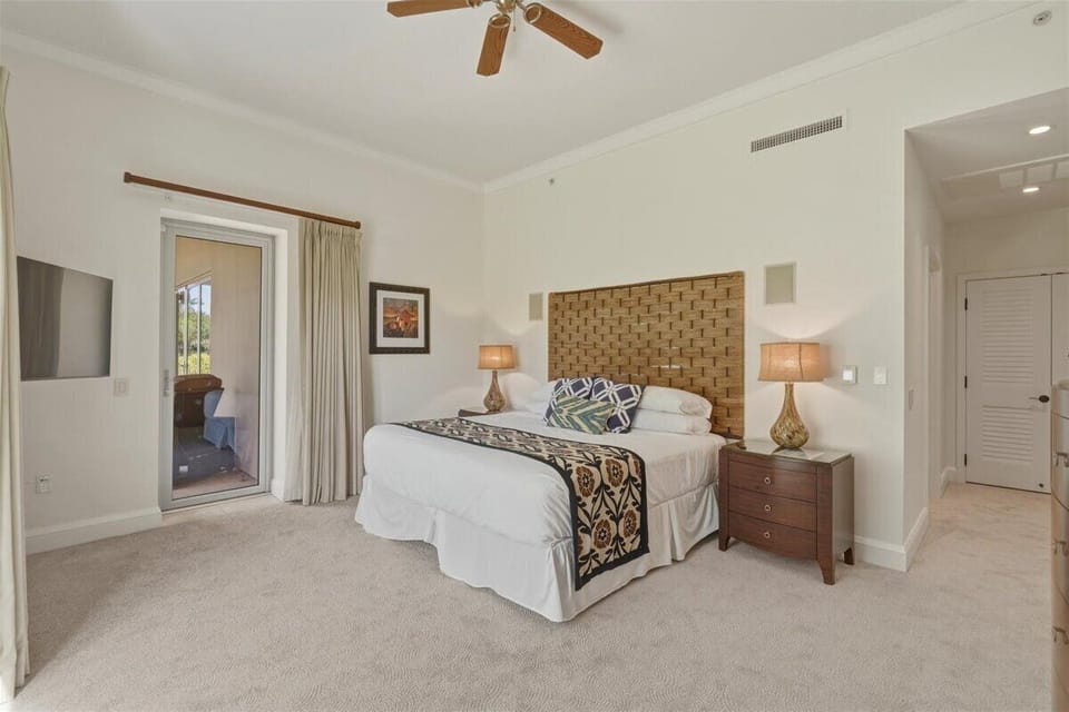 Wake up in the spacious primary suite and step directly onto your private lanai to enjoy Maui's warm tropical mornings.
