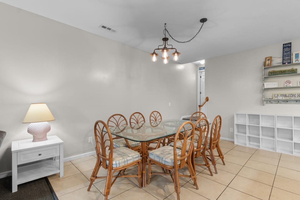 Gather around this spacious dining table for meals and memories, with seating for eight and charming coastal decor that makes every dinner feel like a celebration.