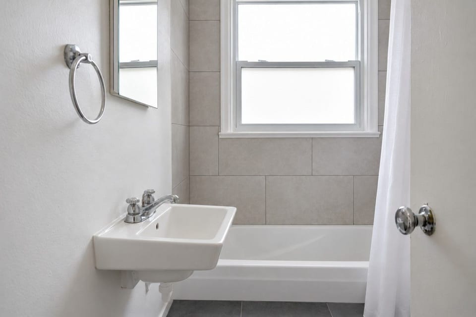 Bathroom with tub and shower