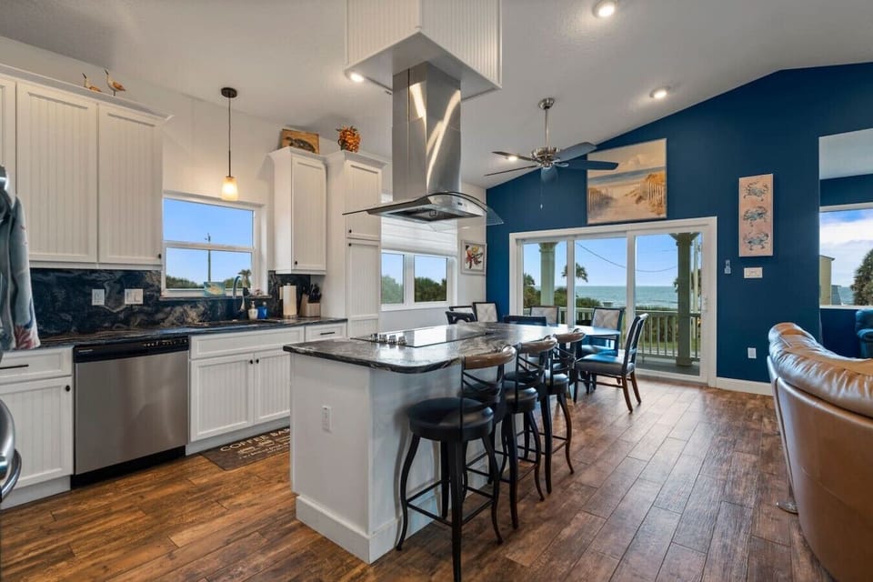 Bar/stovetop seating.  Beautiful, Granite countertops take the kitchen from nice to extraordinary