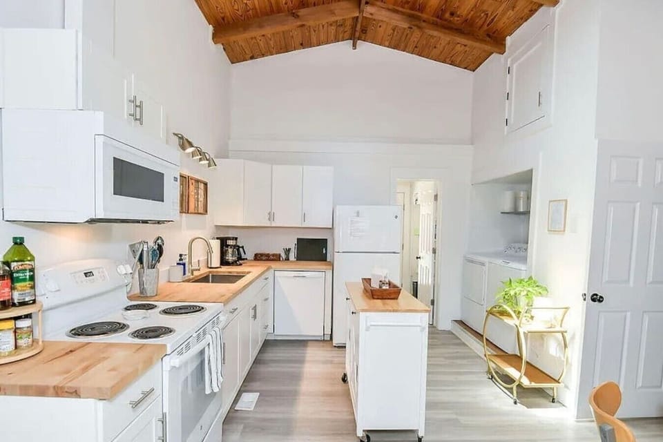 Fully equipped kitchen with butcher block countertops and everything needed for family meals.