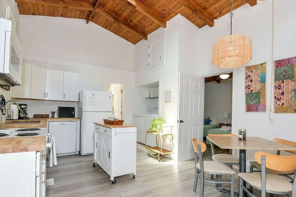 Open-concept kitchen and dining area designed for easy vacation living.
