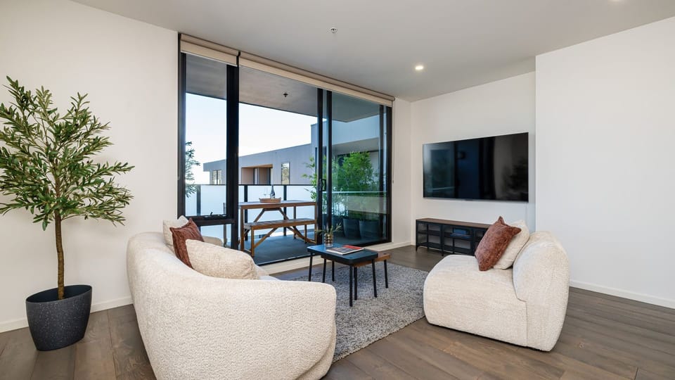 Bright and comfortable living area opening onto the balcony