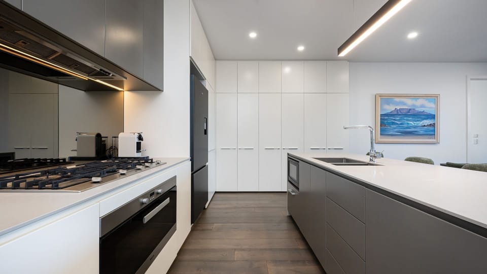 Fully equipped kitchen with gas cooking and generous bench space