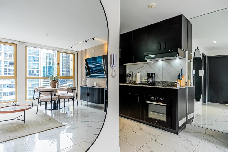 Fully equipped kitchen seamlessly connected to the living area.