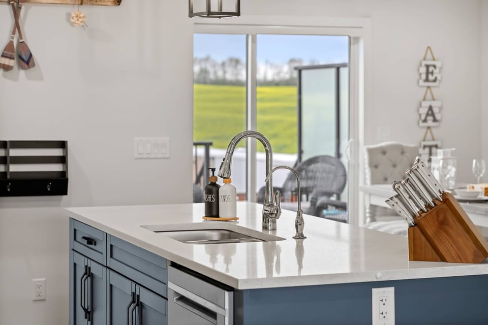 Kitchen sink overlooks the deck and open green space