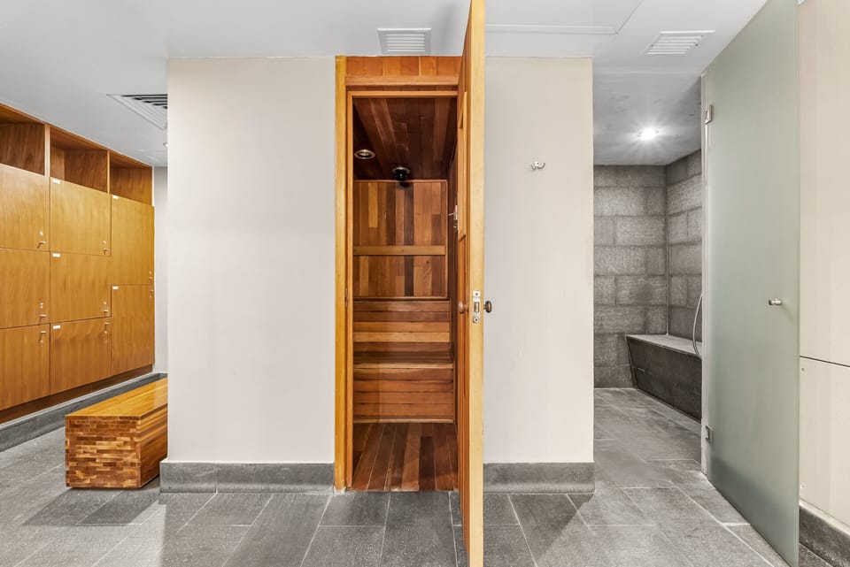 Treat yourself to the ultimate spa experience with access to the building's premium wooden sauna, steam room, and upscale locker room facilities.