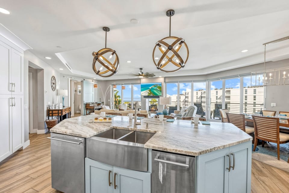 Enjoy Gulf views while preparing meals in this bright, open-concept kitchen.