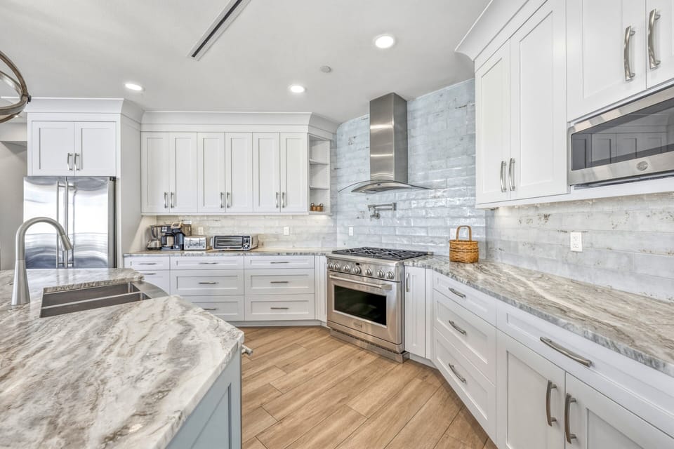 High-end appliances and expansive prep space make every meal effortless.