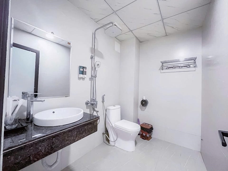 Shower, free toiletries, hair dryer, slippers