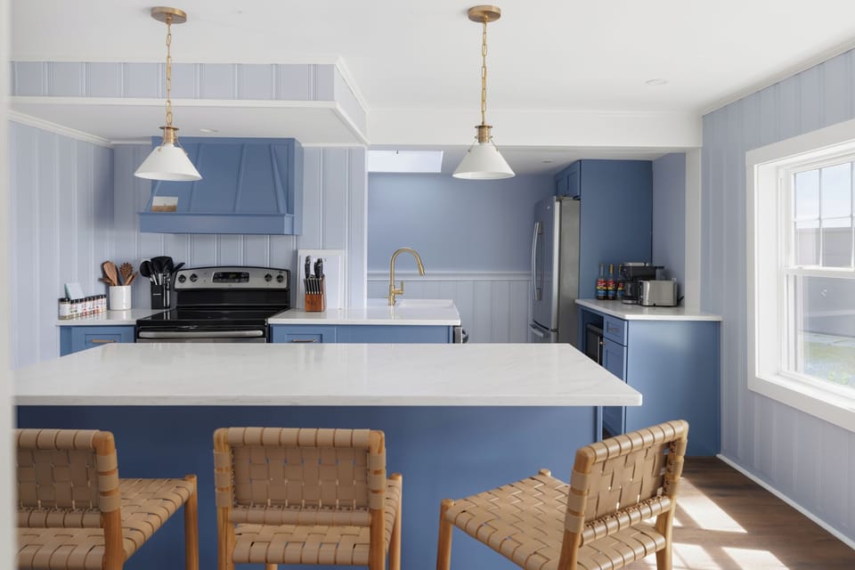  Pull up to the island, pour the coffee, and work out the day’s plan — this kitchen was built for a group and actually fits all of you.