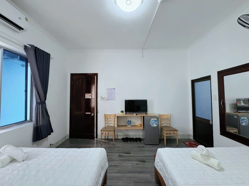 Superior Quadruple Room, City View | Desk, WiFi (free), individually decorated, bed sheets