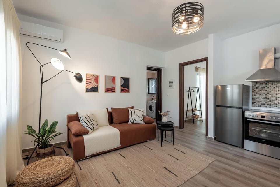 Apartment, Sea View | Living area | 32-inch Smart TV with cable channels