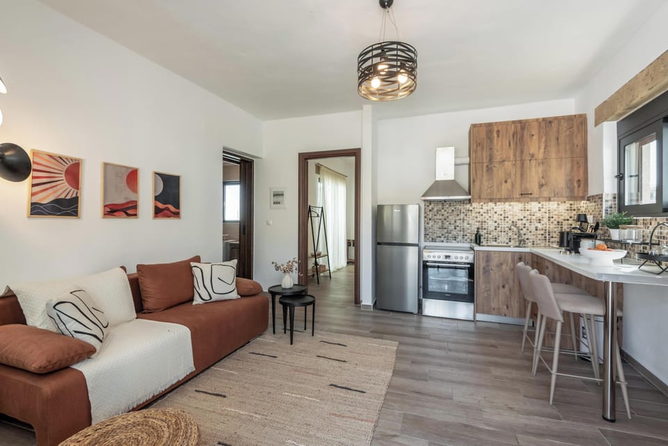 Apartment, Sea View | Living area | 32-inch Smart TV with cable channels
