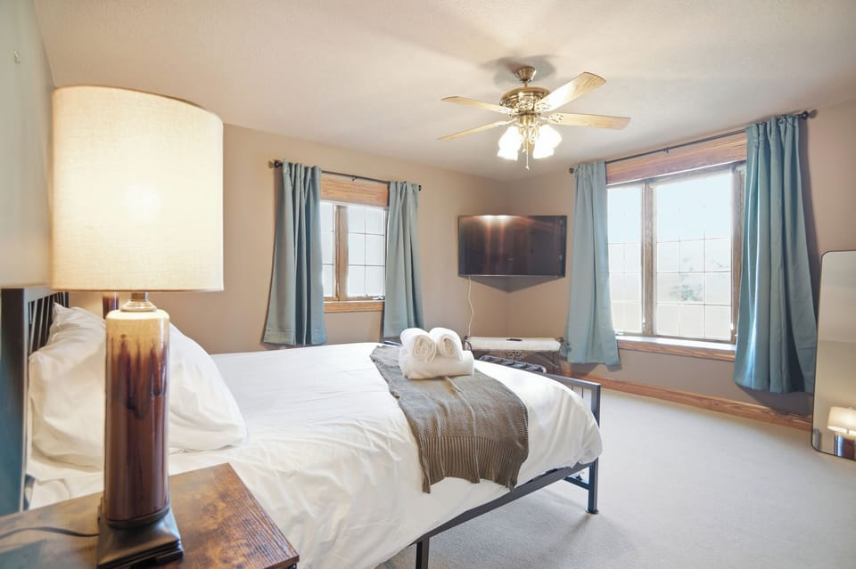 Spacious primary bedroom located on the 2nd floor with a king bed, Roku TV and plenty of natural light