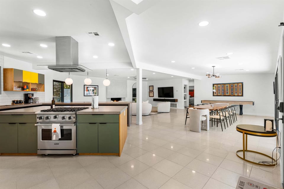 Colorful chef's kitchen opening to the living and dining areas