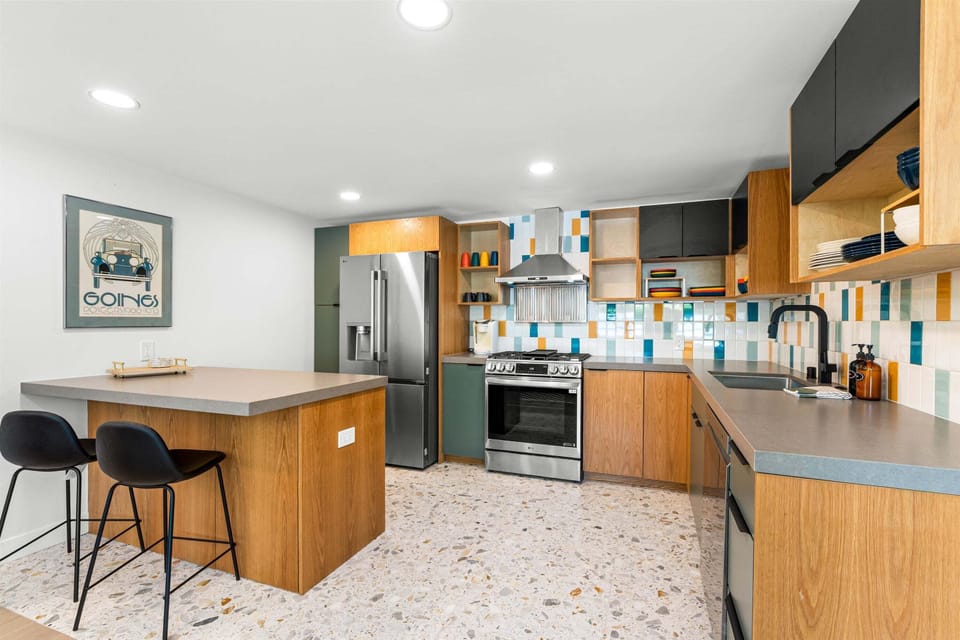 Full casita kitchen with island seating and colorful tile