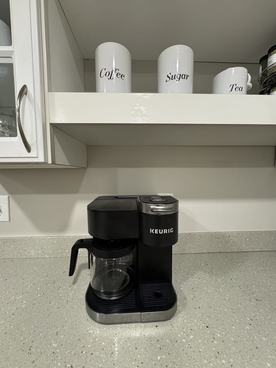 Bright coffee station with Keurig and stocked coffee