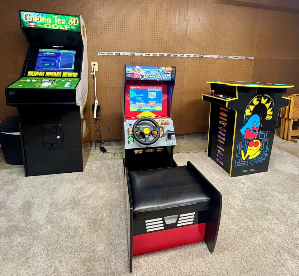 Retro game room with arcade classics, racing fun, and Golden Tee