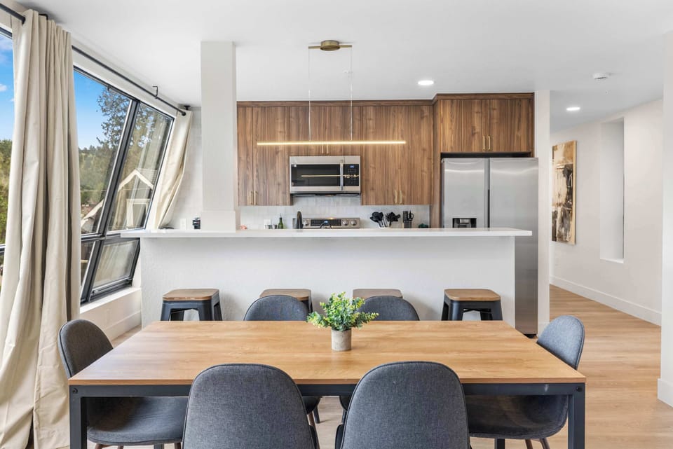 A dining room table or breakfast bar is available to sit at for plenty of space. 