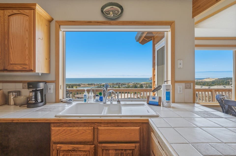 Stunning ocean and coastal views frame your kitchen space, where natural light and fresh sea breezes create an inspiring backdrop for your morning coffee or meal preparation.