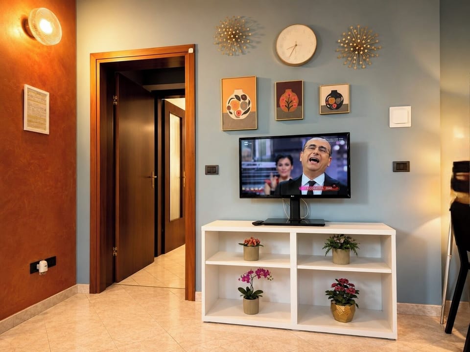 Deluxe Apartment, 1 Bedroom, Kitchenette | Living area | Flat-screen TV