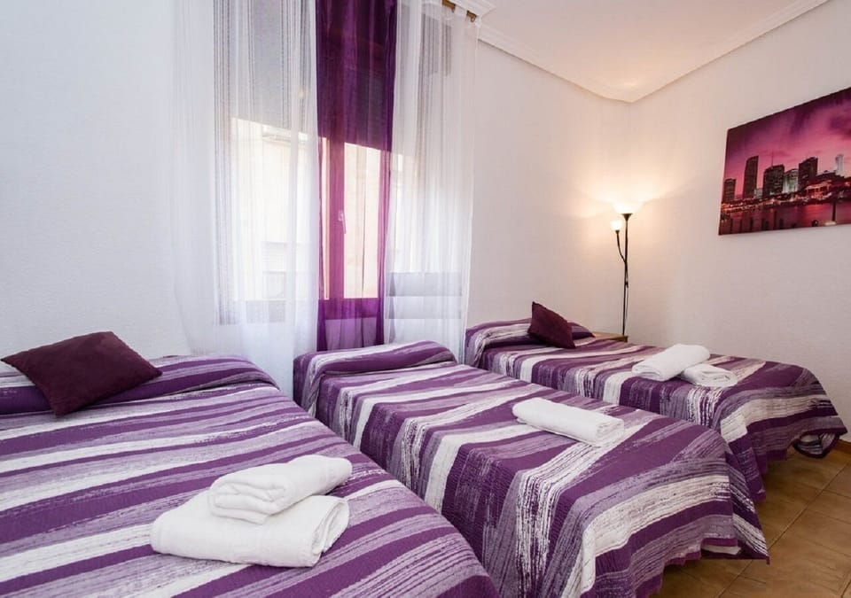 Basic Triple Room, Shared Bathroom | Free WiFi, bed sheets