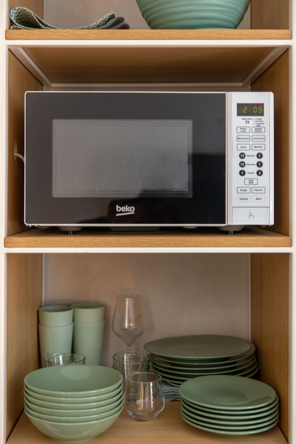 Dishes, glasses and microwave, stocked for a full stay