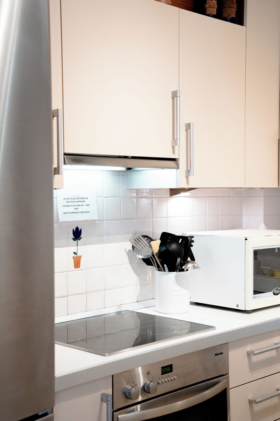 Bright, fully equipped kitchen with quality appliances, generous counter space, 