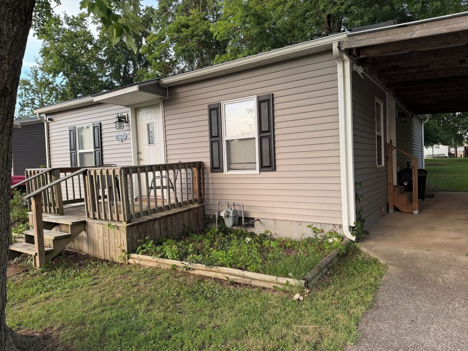 Exterior of the home, with carport