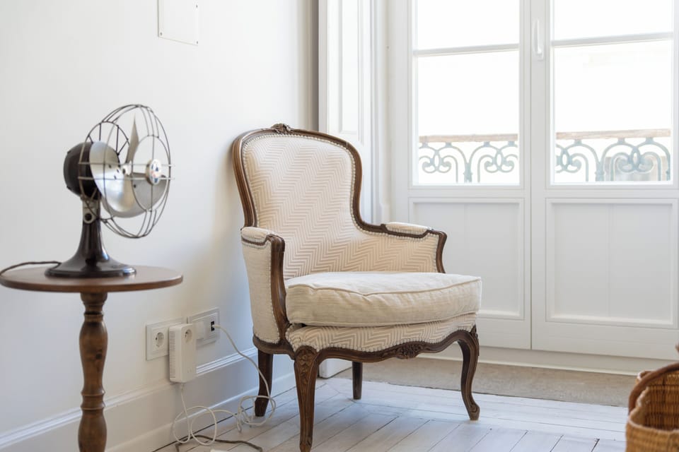 Bright reading nook with vintage charm and French balcony doors