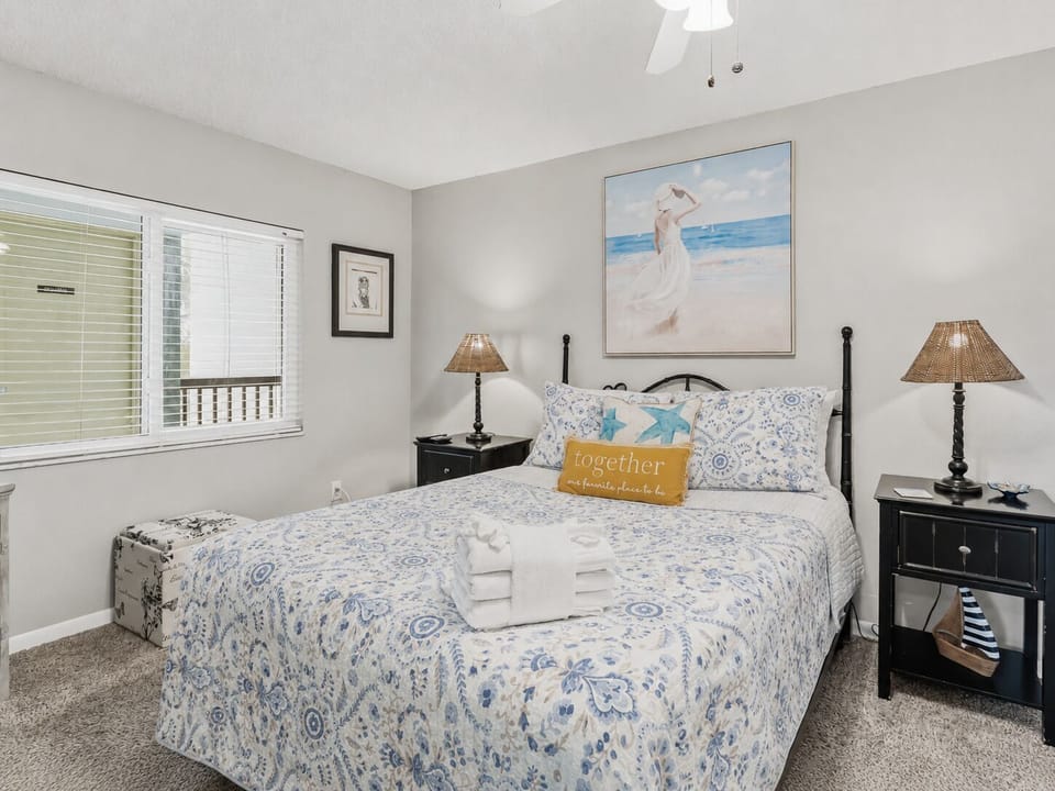 2nd bedroom with Queen bed, TV, and ceiling fan
