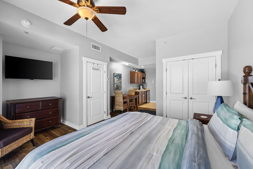 Wake up in this bright, airy bedroom where coastal touches meet home comfort. Your ceiling fan keeps you cool while the TV and ample storage keep you entertained and organized.