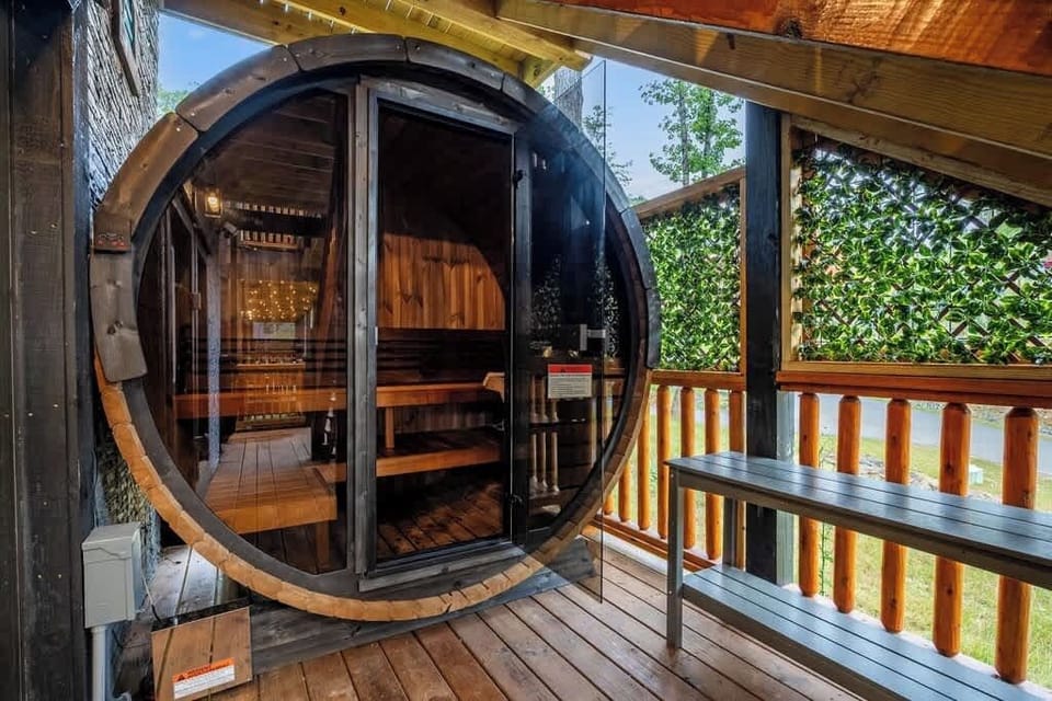 Private barrel sauna on a cozy covered deck for a relaxing retreat