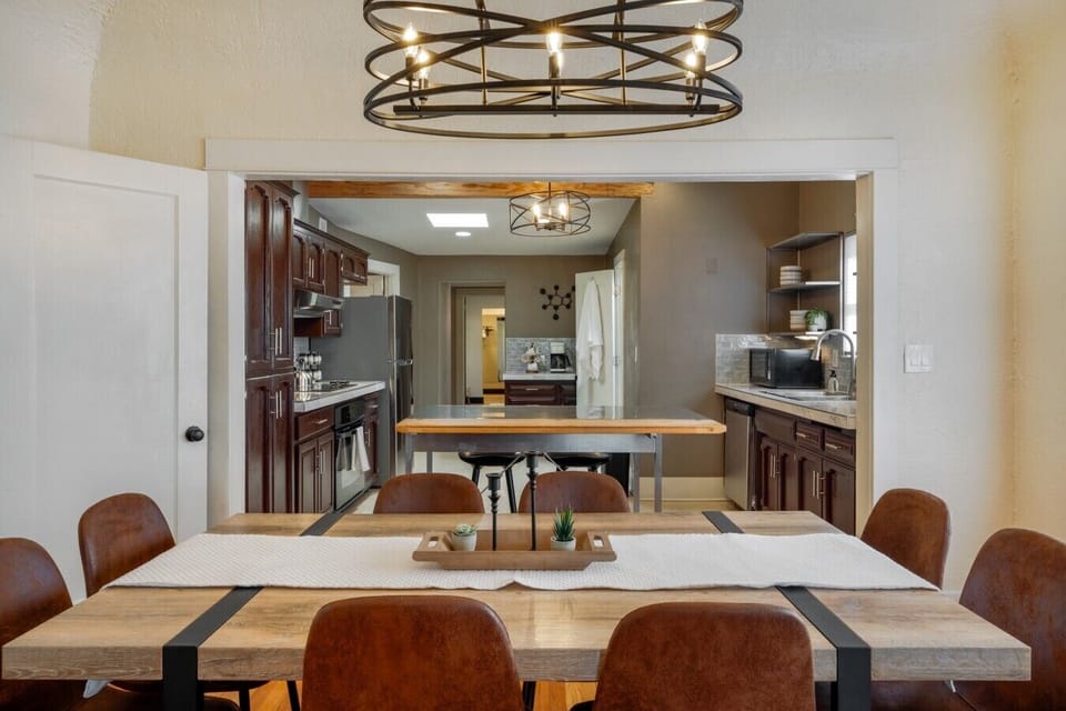 Gather around the farmhouse-style dining table, open to the kitchen and just off the living room