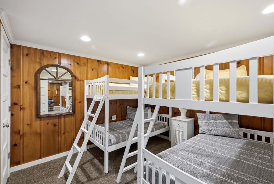 Two bunk beds make this room perfect for the kids, with plenty of sleeping space for the whole crew